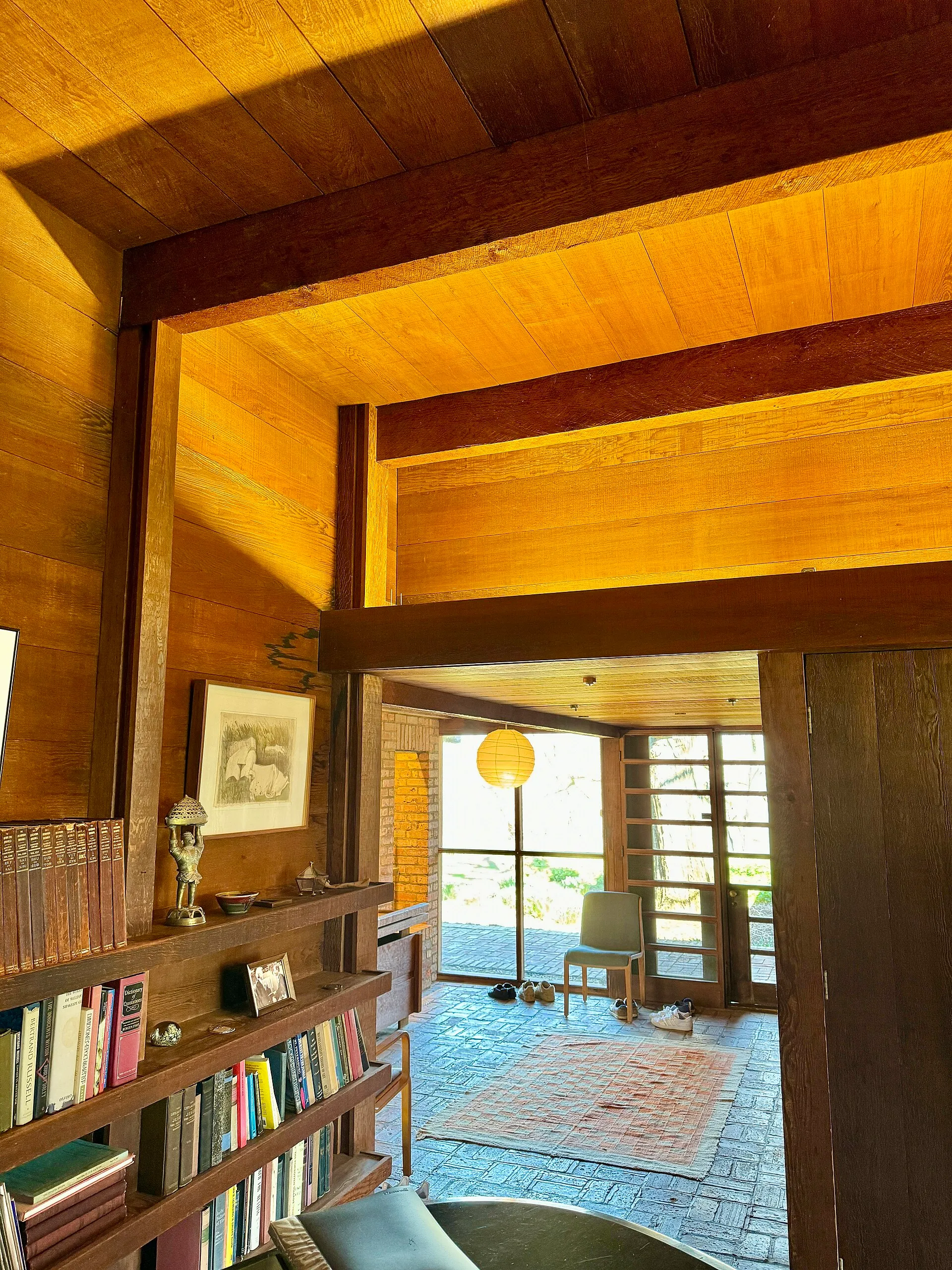 A warm timber guest suite at golden hour